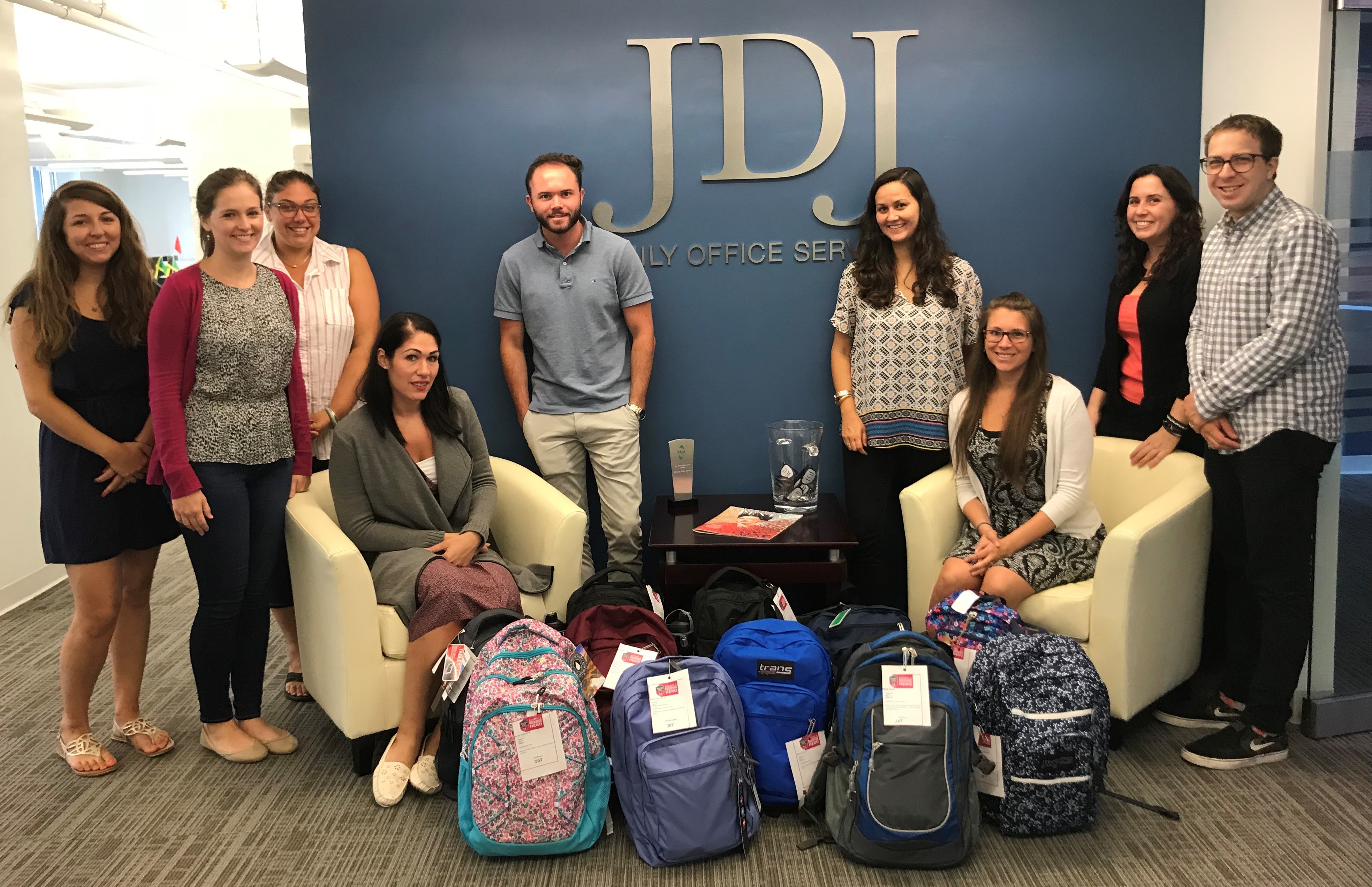 Pictured above, a few of this year’s JDJ Backpack Heroes with backpacks full of supplies, (from left): Gina Perrotta, Elizabeth Fogarty, Elana Vasi, Rachel DeIeso, Christian Flavin, Mallory Garneau, Angela Simmons, Vicki Saris, Stafford Turnage. Additional heroes are not pictured.